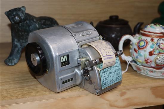 A Gibson A14 London bus ticket machine and a Swedish AB Almex ticket machine, both in fitted leather cases